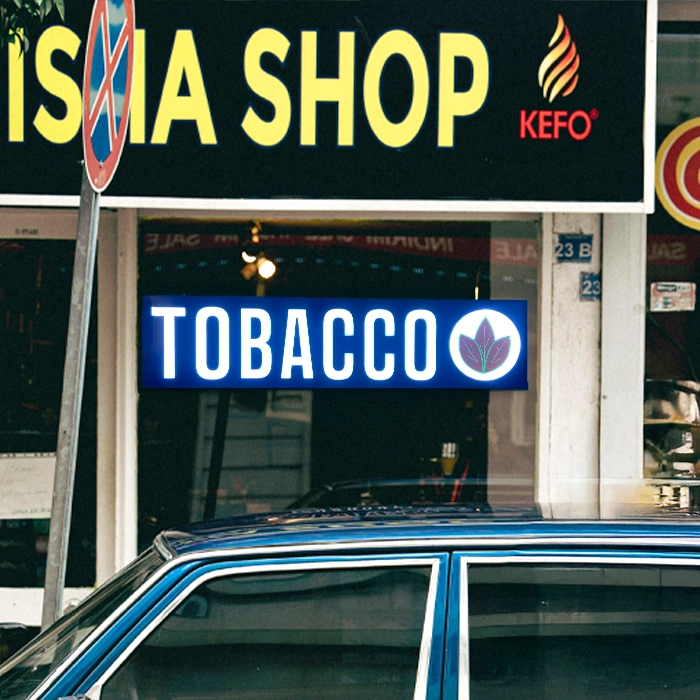 Tobaccos Shop sign LED with tobacco leaf design on a storefront