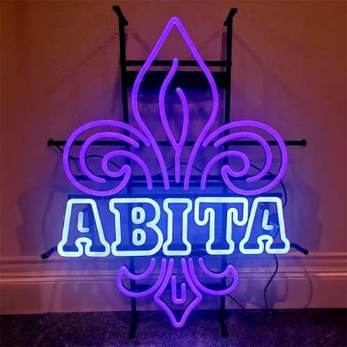 A custom made purple LED neon sign with the word ABITA in white