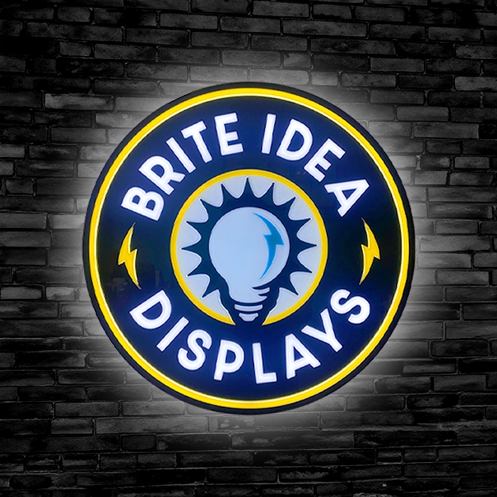 Brite Idea Displays LED Sign on a black brick background.