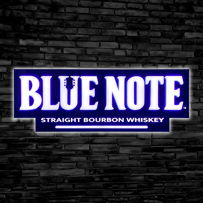 Blue note straight bourbon whiskey custom LED Sign on a black brick wall