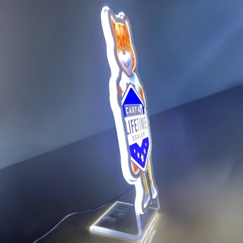 A neon sign with an image of a cat on it, which is non-illuminated.
