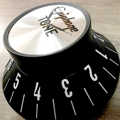 A high quality black and silver clock with numbers.