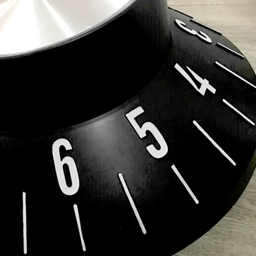 A sleek silver and black clock.