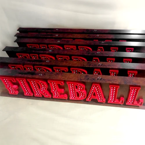Four non-illuminated wooden signs with the word fireball on them.