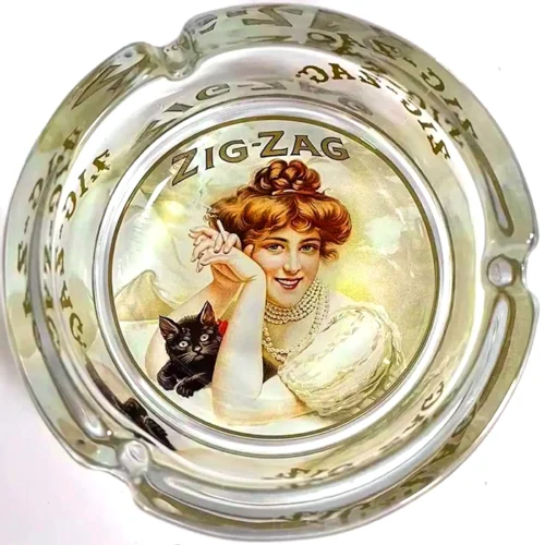 A high quality glass ashtray depicting a woman and a cat from Zig Zag.