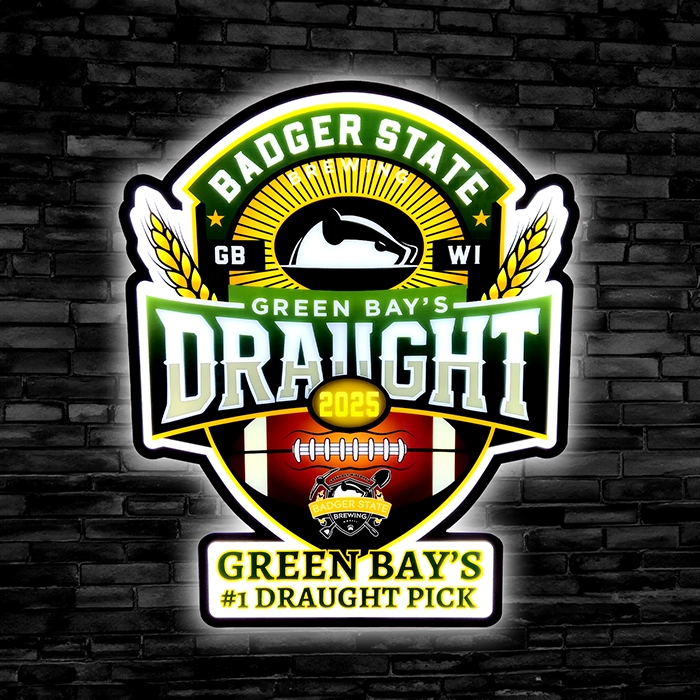 Green Bay's Badger State 2025 Draught Pick LED bar sign against a black brick wall